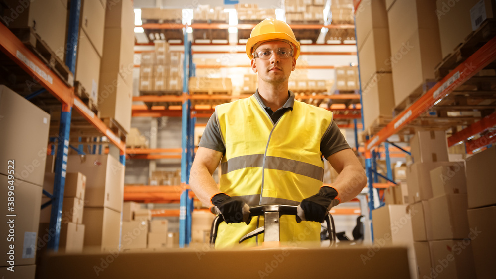 Worker Moves Cardboard Boxes using Hand Pallet Truck, Walking between Rows of Shelves with Goods in Retail Warehouse. People Work in Product Distribution Logistics Center. Point of View Shot