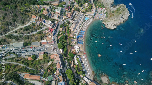 View over the beaches of Taormina, Italy, with turquoise sea and a sunny sky