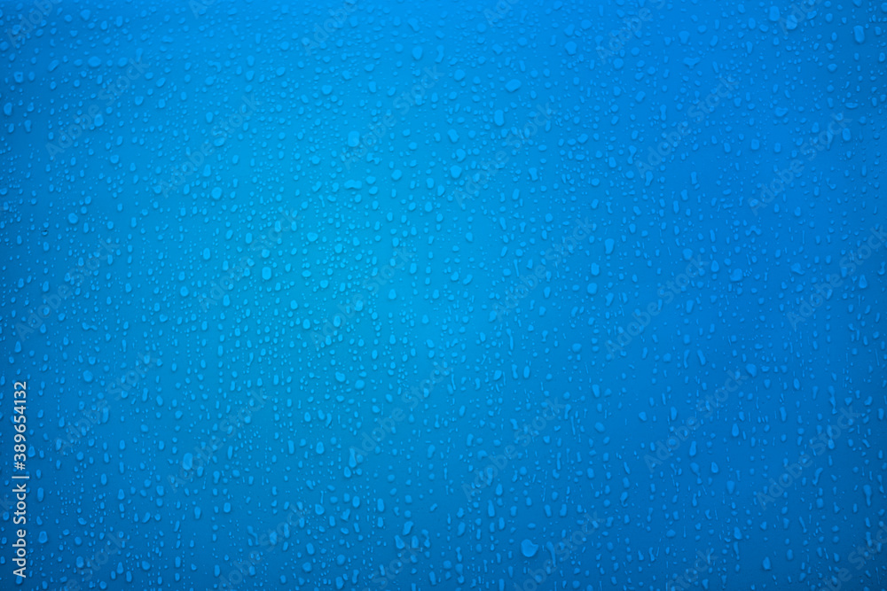 Rain drops on blue metal background close-up. Water drops blue texture Rain drops on blue metal background close-up. Water drops blue texture