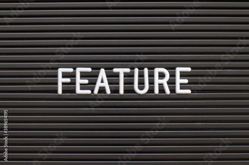 Fotografie Black color felt letter board with white alphabet in word feature background