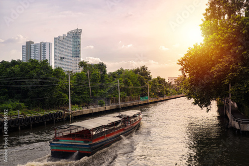 Saen Saeb express boat taking passengers to the next station along the canal towards the Chao Phraya river in Bangkok, Thailand