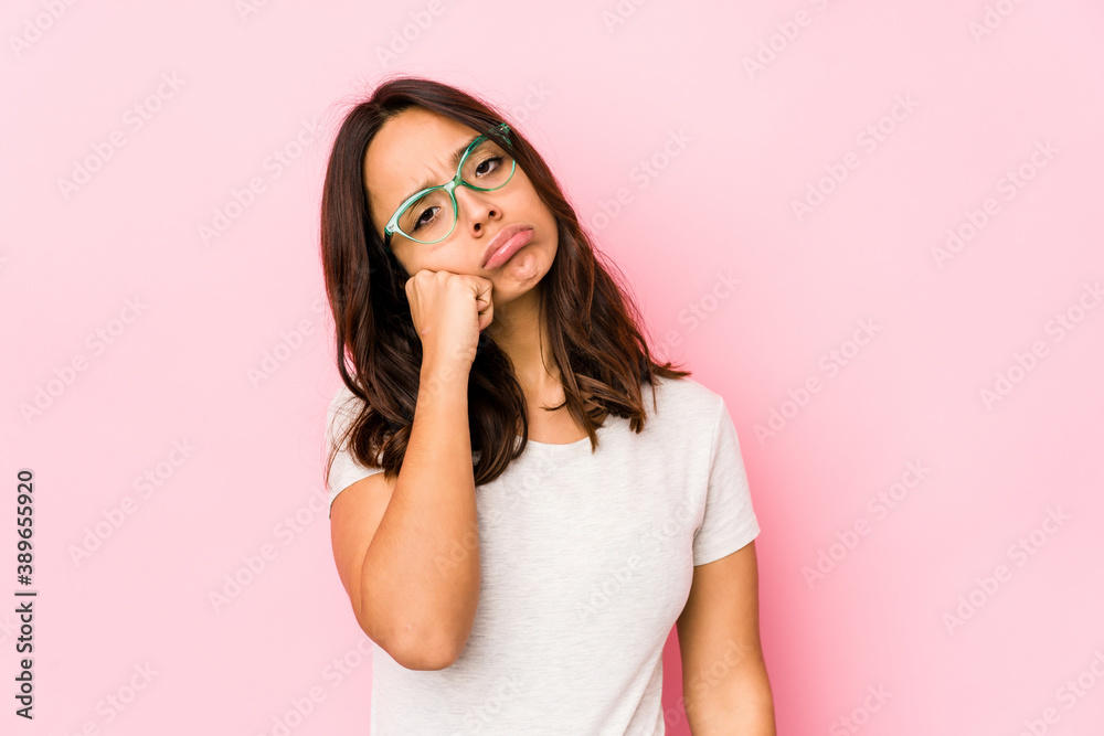 Young mixed race hispanic woman isolated tired of a repetitive task. Young mixed race hispanic woman isolated tired of a repetitive task.