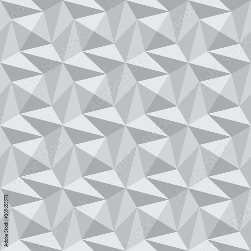 Abstract volumetric seamless pattern. Monochrome gray polygonal background. Faceted surface repeating background.