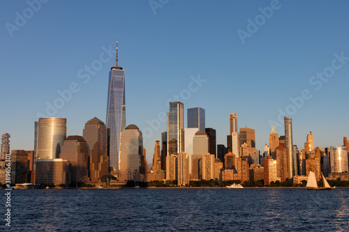 Lower Manhattan Skyline along the Hudson River in New York City Shining during a Sunset © James