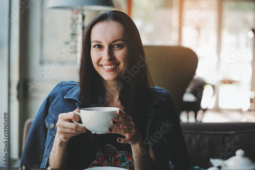 Woman sitting with cup of tea
