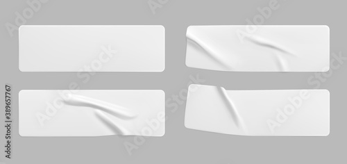 White glued crumpled rectangle stickers mock up set. Blank white adhesive paper or plastic sticker label with wrinkled and creased effect. Template label tags close up. 3d realistic vector