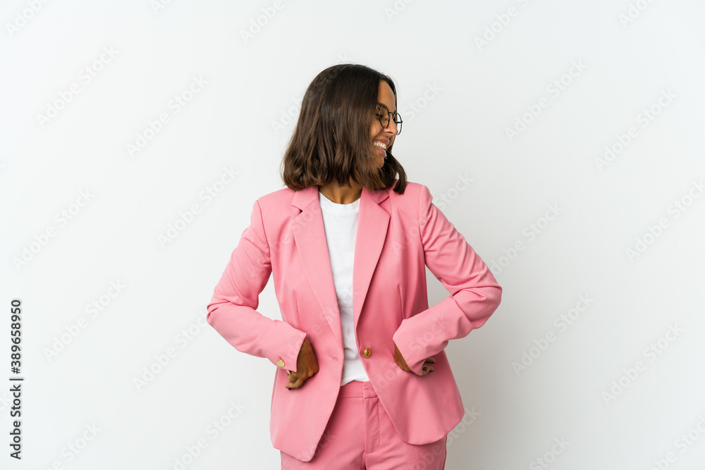 Young latin business woman isolated on white background celebrating a victory or success, he is surprised and shocked. Young latin business woman isolated on white background celebrating a victory or success, he is surprised and shocked.