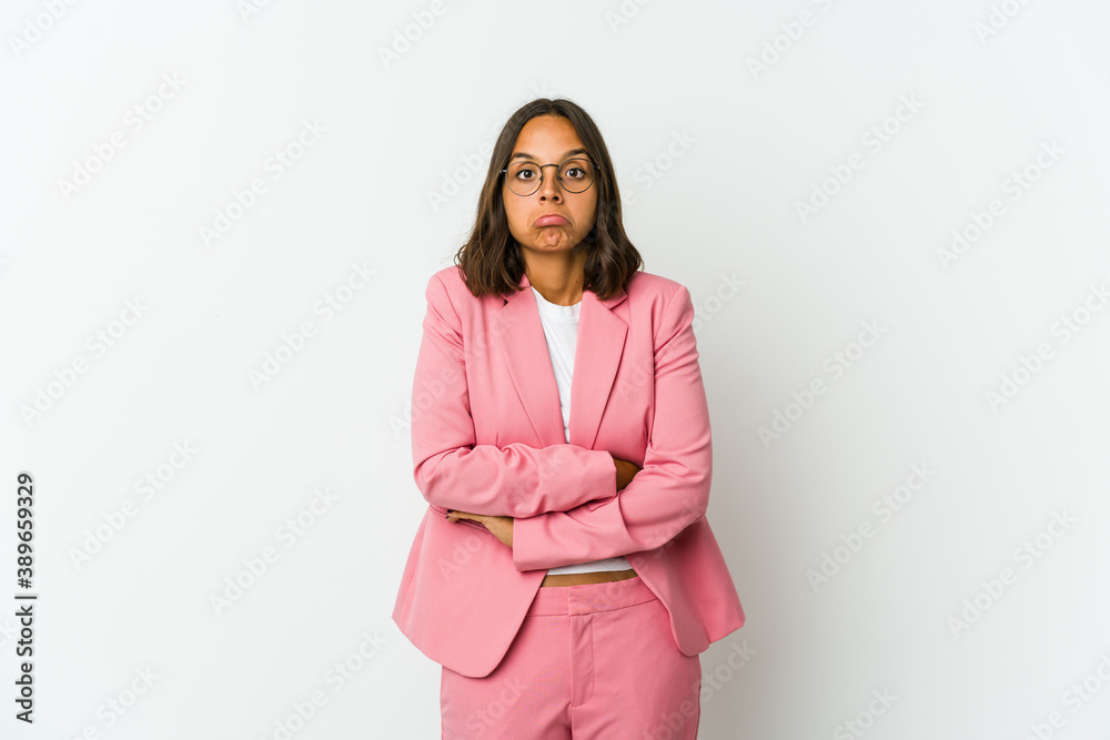 Young latin business woman isolated on white background laughs joyfully keeping hands on head. Happiness concept. Young latin business woman isolated on white background laughs joyfully keeping hands on head. Happiness concept.