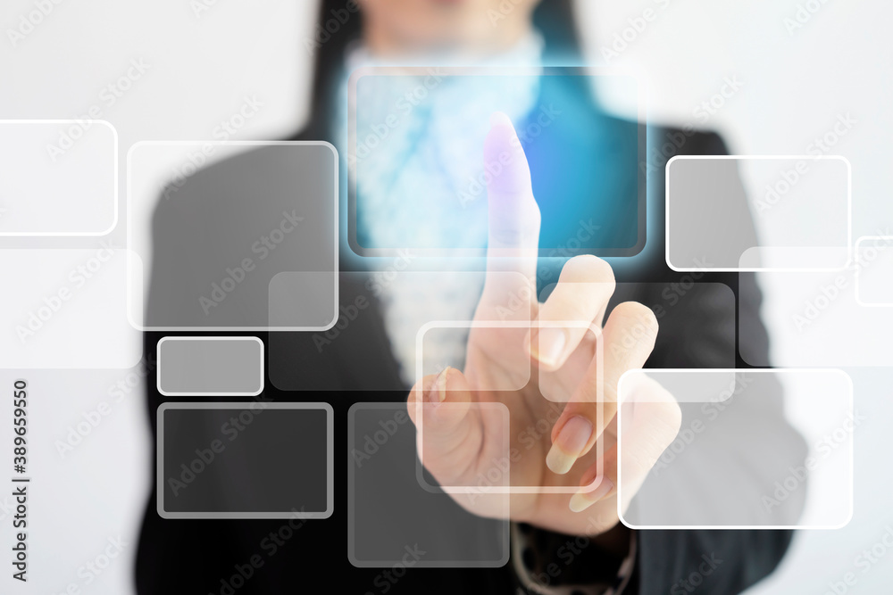 Businesswoman in front of visual touch screen, working with modern virtual technology Businesswoman in front of visual touch screen, working with modern virtual technology