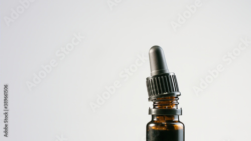 CBD Hemp oil in a bottle with pipette droplet. Cannabis extract for alternative medicine.