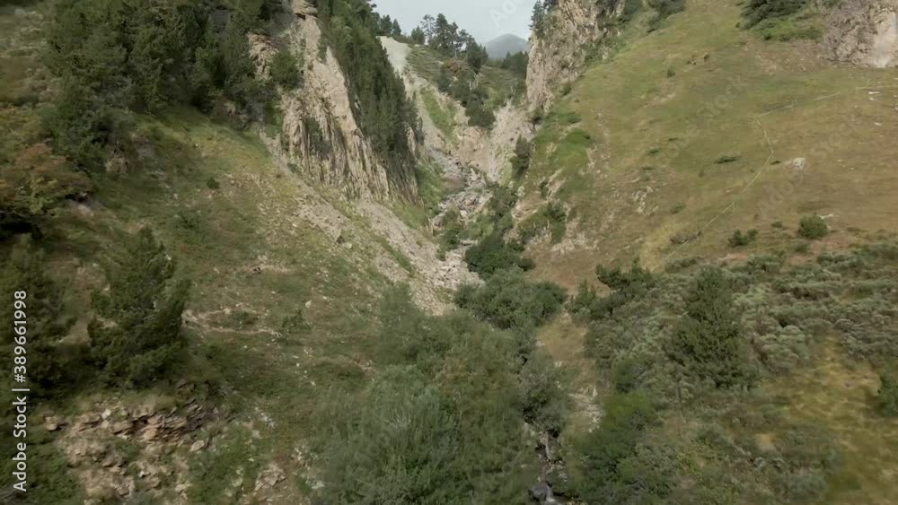 Crossing through a naturally created hole with a river in Catalonia Crossing through a naturally created hole with a river in Catalonia