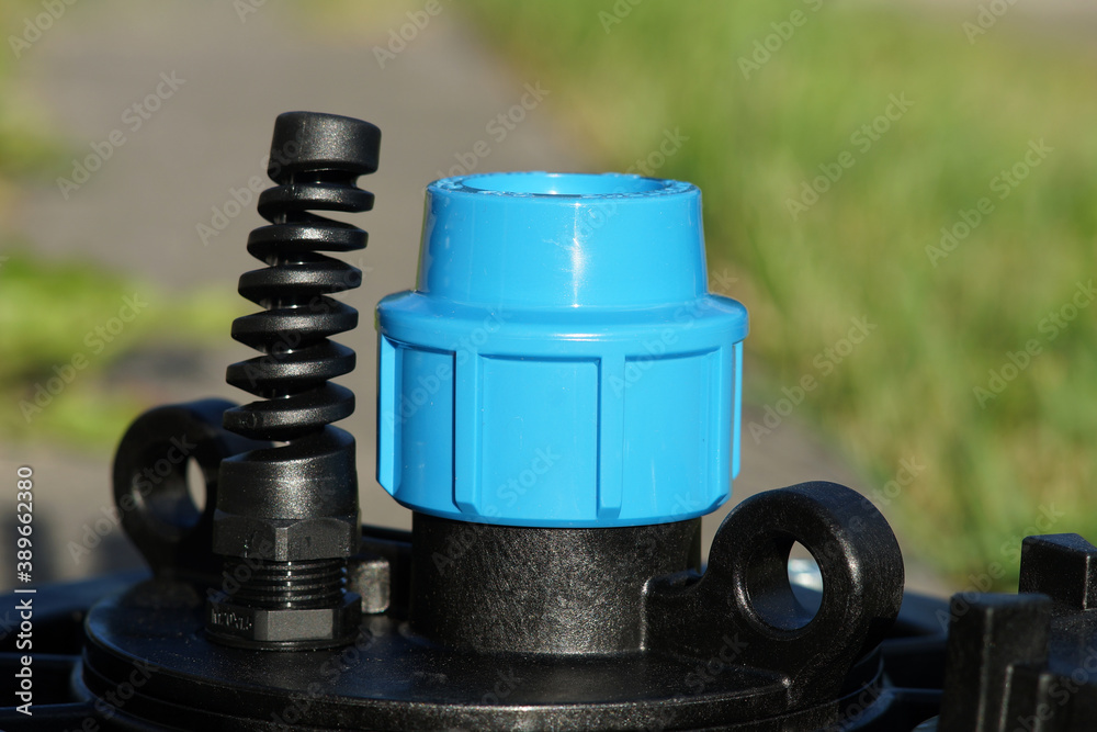 Black plastic bore head. The upper part of the borehole head. Stock ...