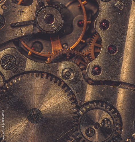 Details of an old mechanical watch close-up. Selective focus on details. Grunge background of vintage clock elements