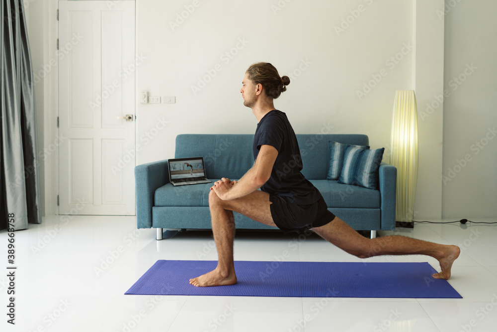 Man doing stretching exercises on a mat