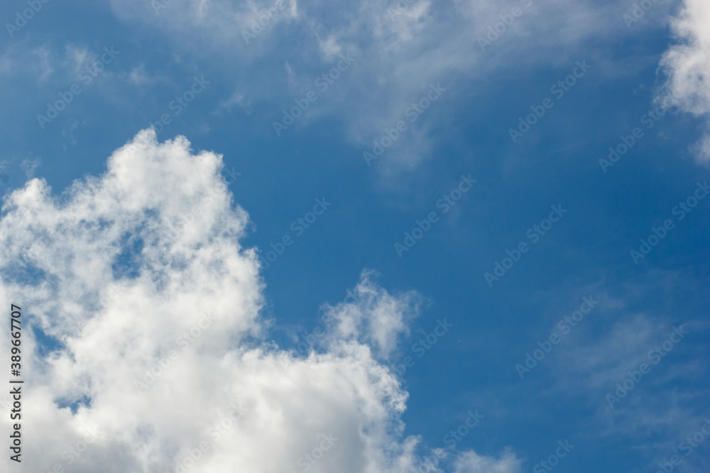 Fototapeta premium cumulus and high-cumulus clouds of an average tier on blue heavenly space