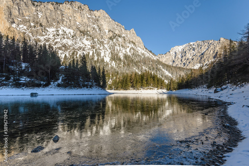 Peaceful mountain view with famous green lake in Austria Styria. Tourist destination lake Gruner See in winter. Travel spot situated in Tragos in lime stone Alps of Hochschwab.