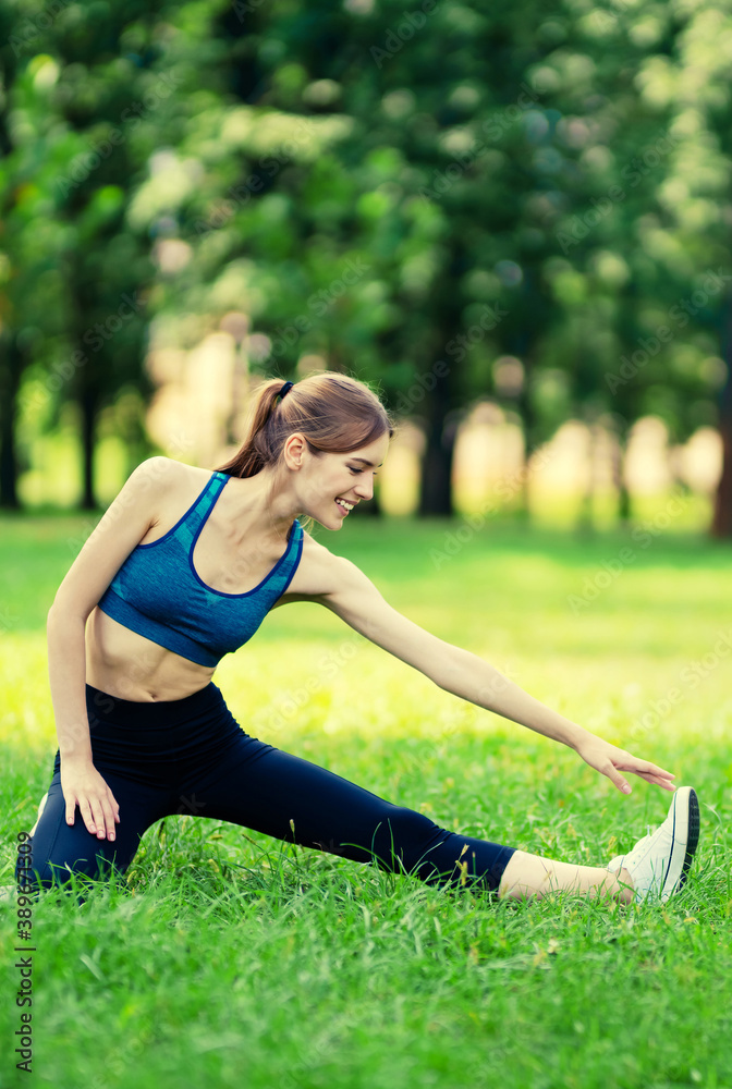 Smiling woman in fit wear doing stretching exercise, before morning jogging or workout, outdoor. Fitness, sport, exercising, crossfit and workout concept. Caucasian girl at training. Smiling woman in fit wear doing stretching exercise, before morning jogging or workout, outdoor. Fitness, sport, exercising, crossfit and workout concept. Caucasian girl at training.