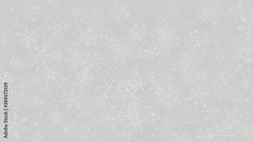 Christmas background of snowflakes of different shapes, sizes and transparency in gray and white colors
