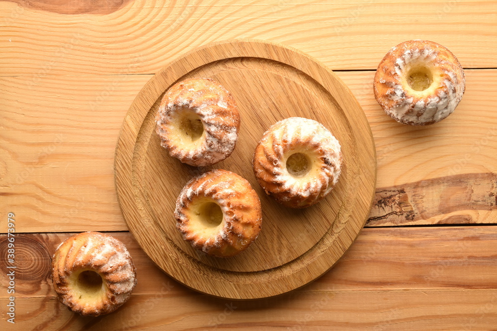 Fragrant sweet cupcakes, close-up, on a wooden table. Fragrant sweet cupcakes, close-up, on a wooden table.