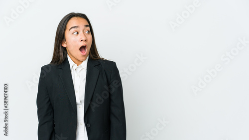 Young asian bussines woman isolated on white background being shocked because of something she has seen.