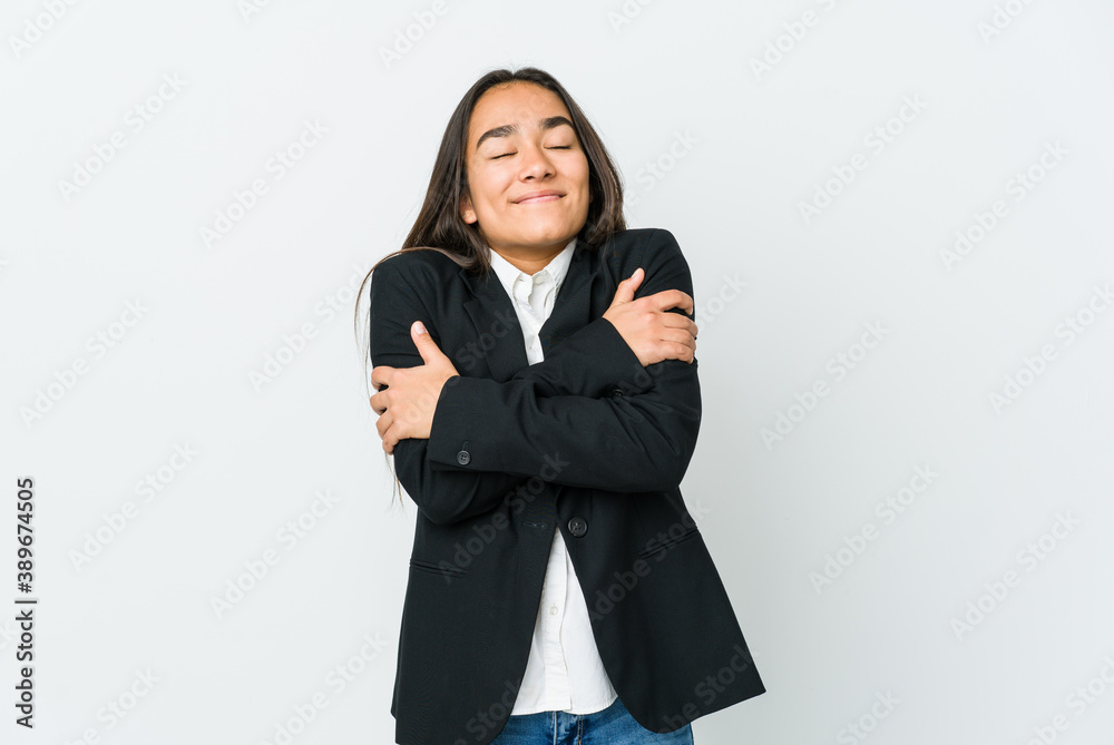 Young asian bussines woman isolated on white background hugs, smiling carefree and happy. Young asian bussines woman isolated on white background hugs, smiling carefree and happy.