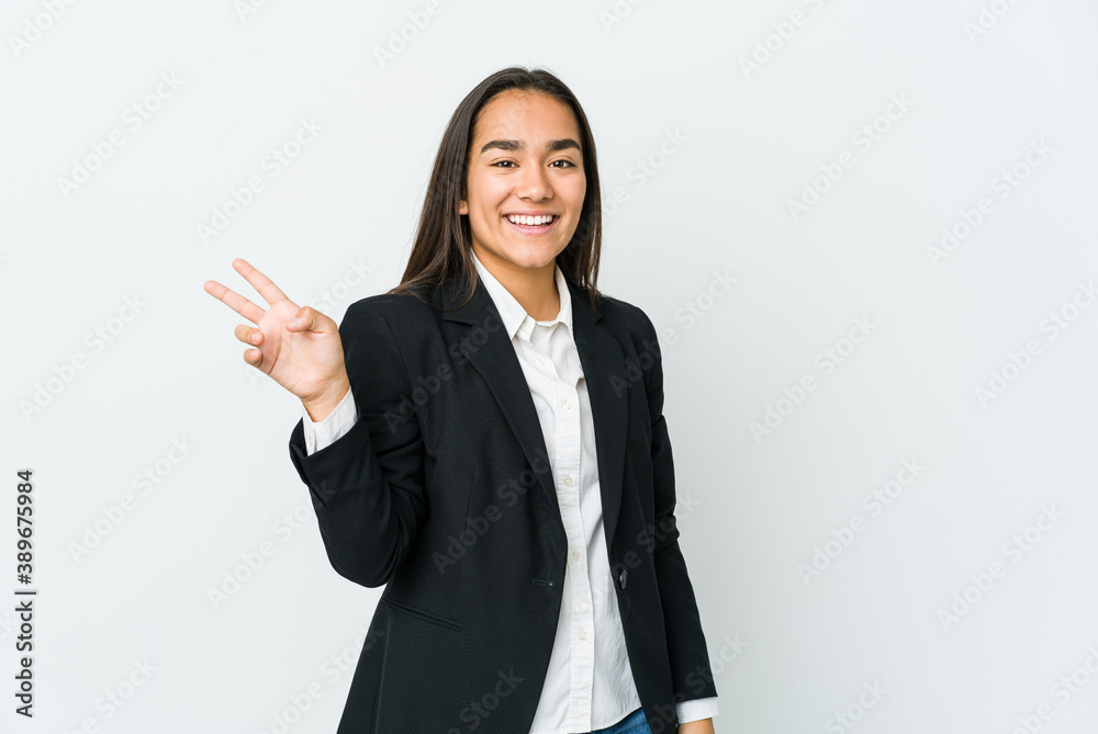 Young asian bussines woman isolated on white background joyful and carefree showing a peace symbol with fingers. Young asian bussines woman isolated on white background joyful and carefree showing a peace symbol with fingers.