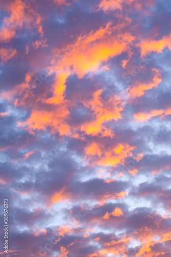 Beautiful clouds at sunset of orange and shades of blue