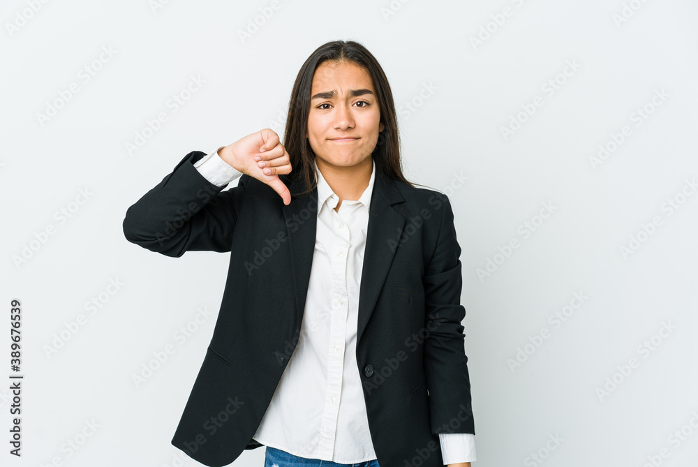 Young asian bussines woman isolated on white background showing a dislike gesture, thumbs down. Disagreement concept. Young asian bussines woman isolated on white background showing a dislike gesture, thumbs down. Disagreement concept.