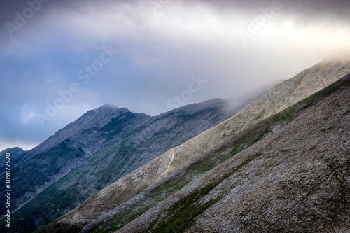 Hiking to Koncheto, view across the peaks of the Pirin Mountains in Bulgaria with Vihren, Kutelo,Todorka,Banski Suhodol , National Park Pirin with company of wild goats photo