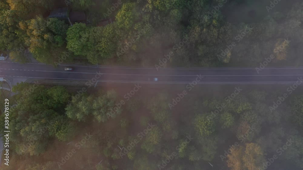Drone aerial view of road during foggy morning. Top down view Drone aerial view of road during foggy morning. Top down view