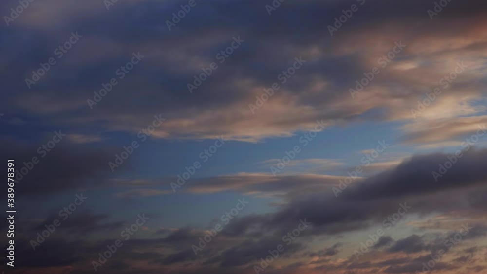 A time lapse shot with moving clouds showing a sunrise A time lapse shot with moving clouds showing a sunrise