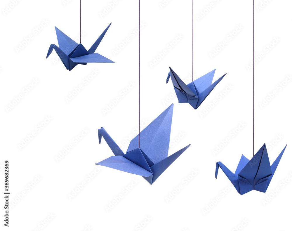 a haning blue origami bird paper on white a haning blue origami bird paper on white