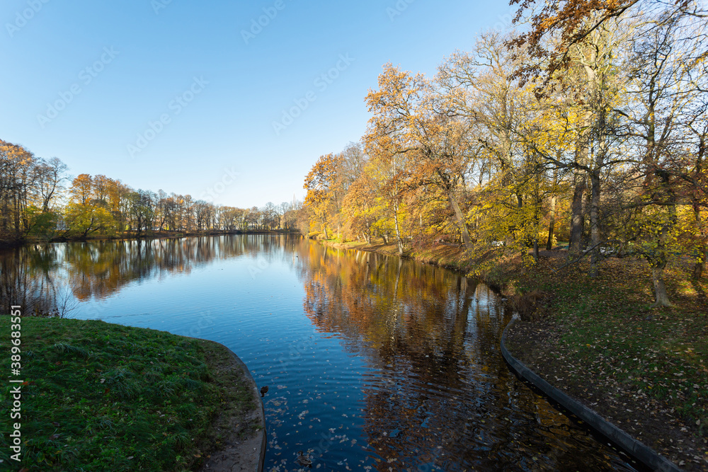 River flows through the park in mid-autumn in Russia. River flows through the park in mid-autumn in Russia.