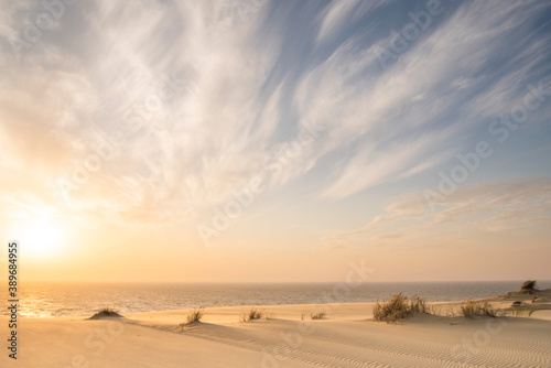 Sand dunes in Kaliningrad. Natural background. Sunrise.