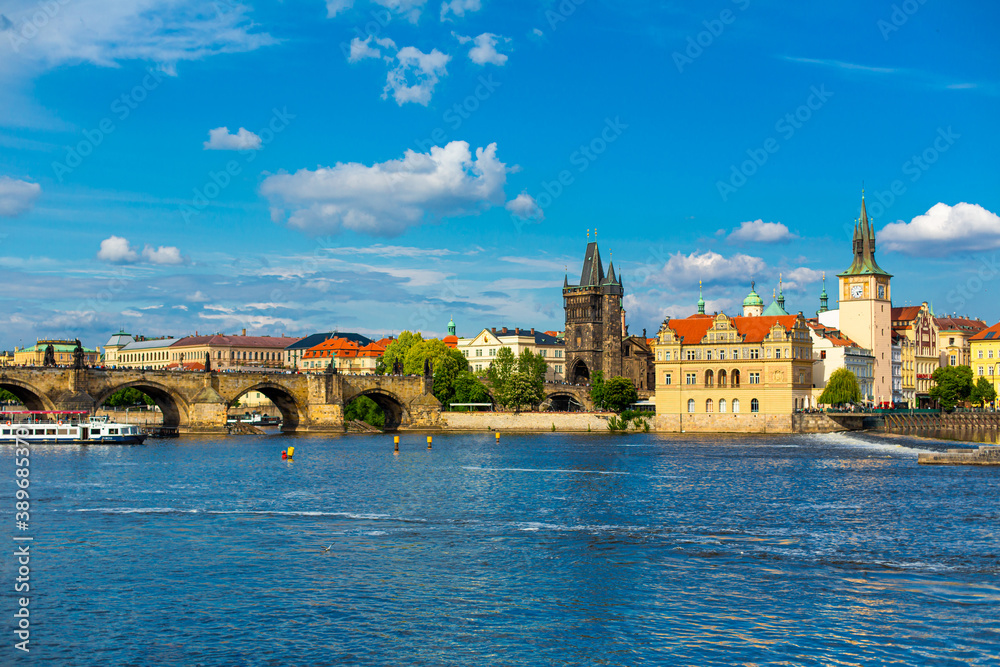 Fototapeta premium The landscape of the city of Prague view from the Vltava river on the ancient architecture of the city