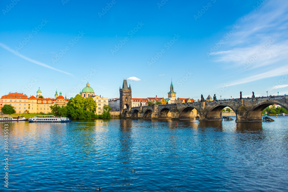 Obraz premium Summer landscape of Prague view of the Ltava river and the famous Charles bridge