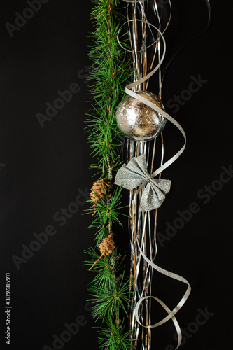 Christmas and New Year's holiday black background with copy space, Christmas border. Flat lay. Christmas branch. Christmas composition