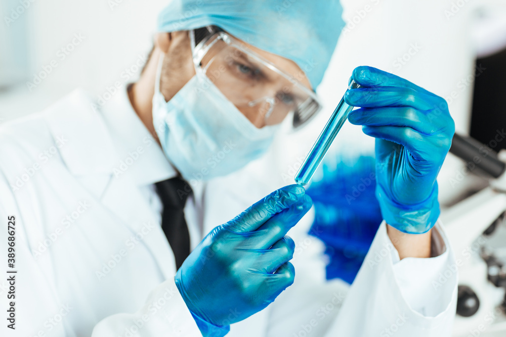 close up. sample of the vaccine in the hands of a scientist . close up. sample of the vaccine in the hands of a scientist .