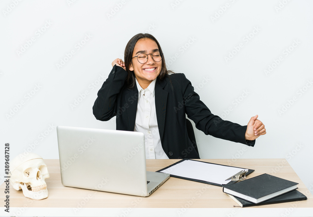 Young traumatologist asian woman isolated on white background dancing and having fun. Young traumatologist asian woman isolated on white background dancing and having fun.