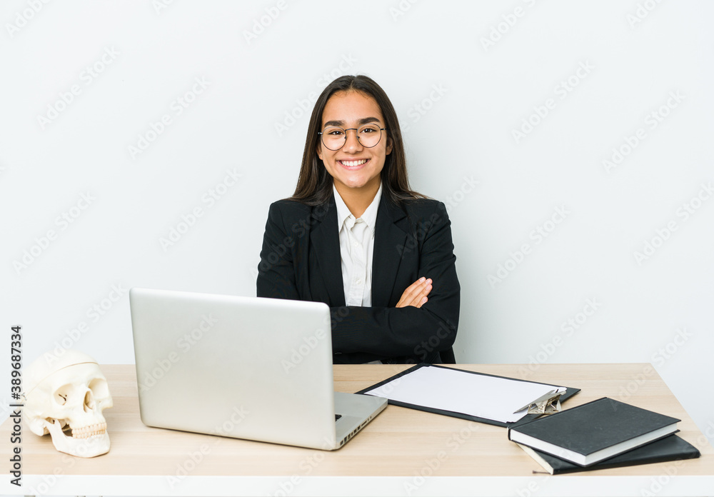 Young traumatologist asian woman isolated on white background who feels confident, crossing arms with determination. Young traumatologist asian woman isolated on white background who feels confident, crossing arms with determination.