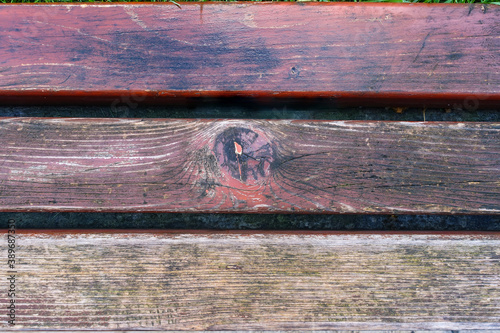 Detail of colorful wooden bench, view from above. Wooden texture and background.