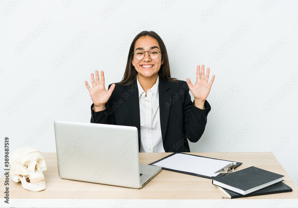Young traumatologist asian woman isolated on white background showing number ten with hands. Young traumatologist asian woman isolated on white background showing number ten with hands.