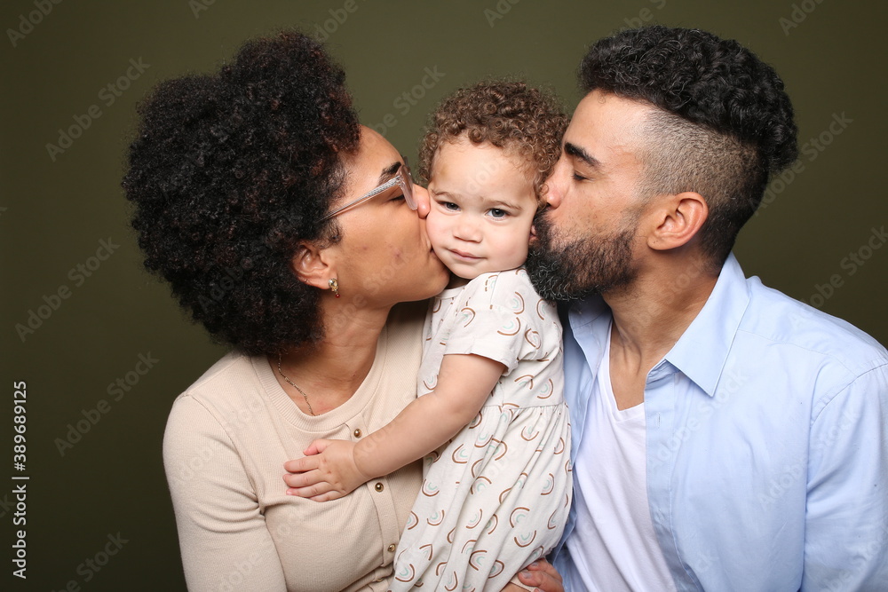 Beautiful happy familie in front of a background Beautiful happy familie in front of a background