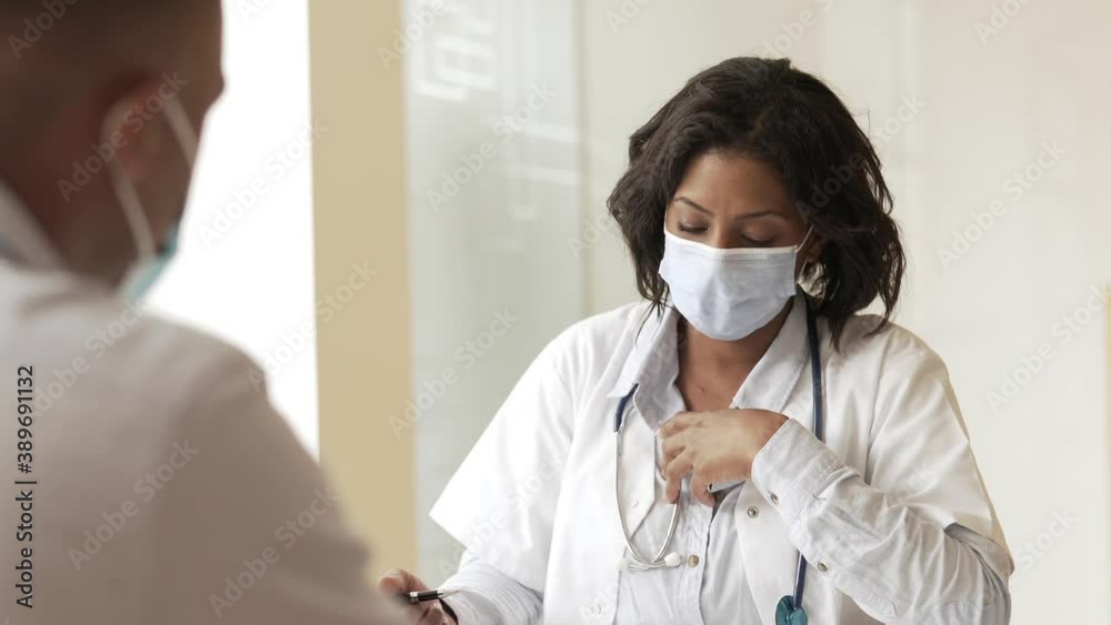 Portrait of young therapist meeting with patient in medical office Portrait of young therapist meeting with patient in medical office