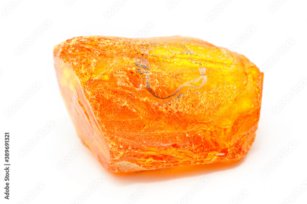 A piece of transparent yellow amber with inclusions on a white background. Natural fossil fossilized resin. Crystal. Colored mineral copal. Sun stone. Material for jewelry. Ancient tar A piece of transparent yellow amber with inclusions on a white background. Natural fossil fossilized resin. Crystal. Colored mineral copal. Sun stone. Material for jewelry. Ancient tar