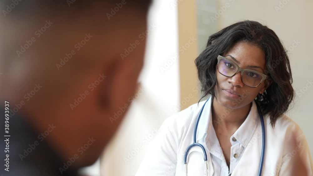 Portrait of young therapist meeting with patient in medical office Portrait of young therapist meeting with patient in medical office