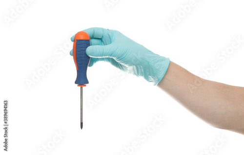 Hand in glove holding a red and black screwdriver isolated over white background.