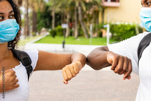 Photography New social distancing greet with elbows for preventing corona virus spread