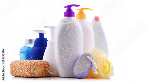 Plastic contaiers of shampoos and shower gels isolated on white photo