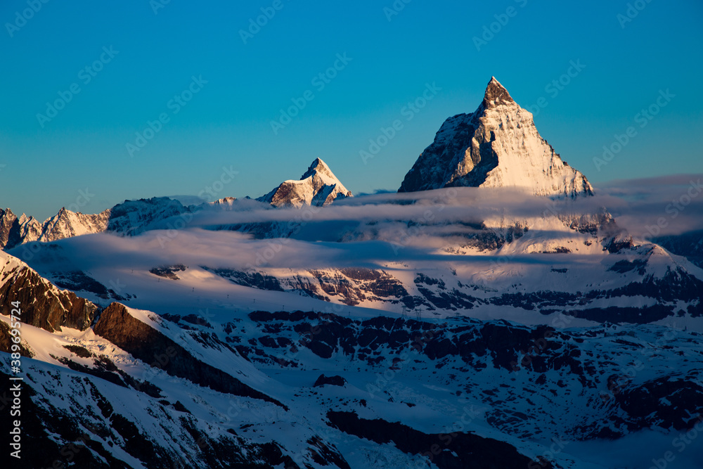 the matterhorn at sunrise covered in snow